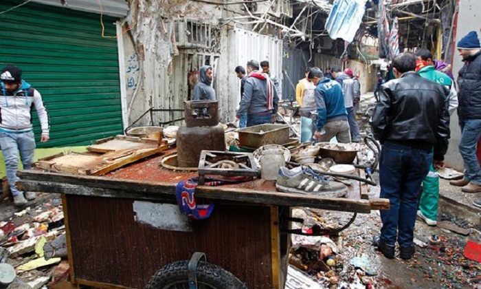 Baghdad market bombings kill dozens 